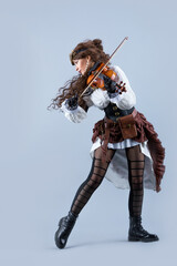 Obraz premium Country girl with viola on the grey background.