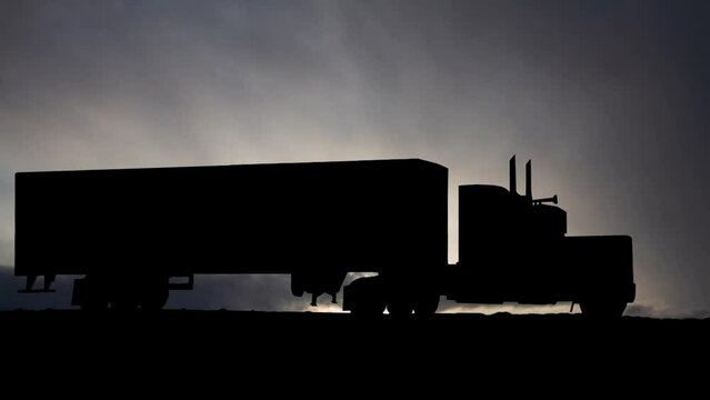 Semi-trailer truck at Sunrise, Time Lapse  with Fast Clouds in Background, USA