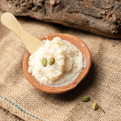 organic kheer or phirni indian dessert in indian sand made bowl 