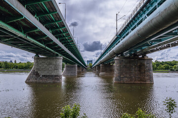 Fototapeta premium Gdanski Bridge and Citadel Rail Bridge over River Vistula in Warsaw city, Poland