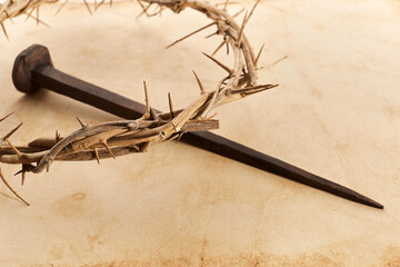Jesus Crown Thorns and nail on Old and Grunge Background. Vintage Retro Style.