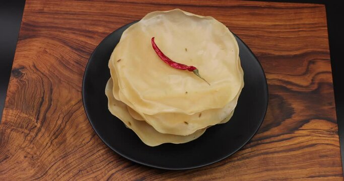 Papad, Khichiya papad, Rice papad, Chawal papad isolated on Wooden background.