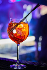 Alcoholic cocktail with ice on the bar counter