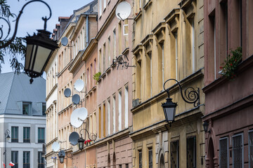 Fototapeta na wymiar Townhouses in area of Old Town of Warsaw city, Poland