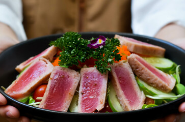 Fresh Tuna Salad Served with Cucumber Roe and Tomato Lettuce Garnished with Salad and Sesame Oil Sauce