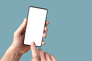 Mobile phone mock-up, finger touching, pointing on smartphone screen, display mockup in hand on blue background