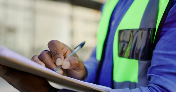 Checklist and man hands, construction worker or building contractor in civil engineering inspection for safety compliance. Urban city, planning and builder person writing notes for architecture job