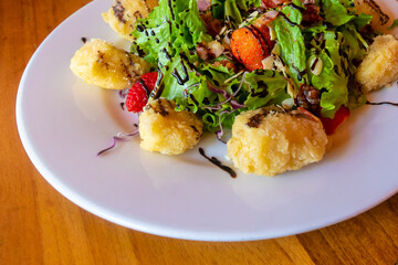 delicious salad with fried mozzarella cheese and balsamic dressing