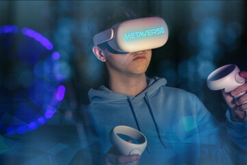 Teenager wearing a VR headset, interacting with virtual reality. Metaverse, digital worlds concept