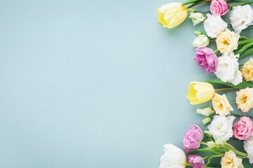 Fototapeta na wymiar Festive composition for Happy mothers day. Spring colorful flowers on pastel blue background. .