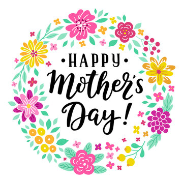 Happy Mother's day hand-drawn lettering phrase. International holiday celebration card with floral wreath. Pink, yellow flower garland. EPS 10 vector illustration isolated on white background.