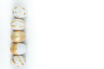 Happy Easter. Painted eggs on isolated white background. Top view. Copy space for text.