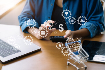 Business woman working on laptop and accounting financial report, accountant using calculator to calculate tax refund at office.