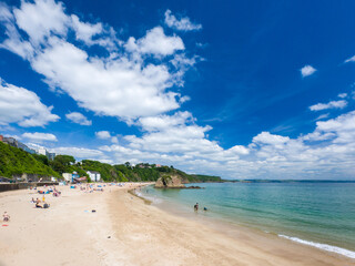 White sandy beach on a sunny day (Tenby, Wales, United Kingdom, in summer)
