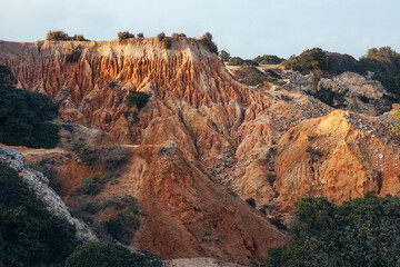 Natural formations in the seven valleys trek along most famous beaches in the Algarve region of Portugal. This place is in la Marina beach at sunset.