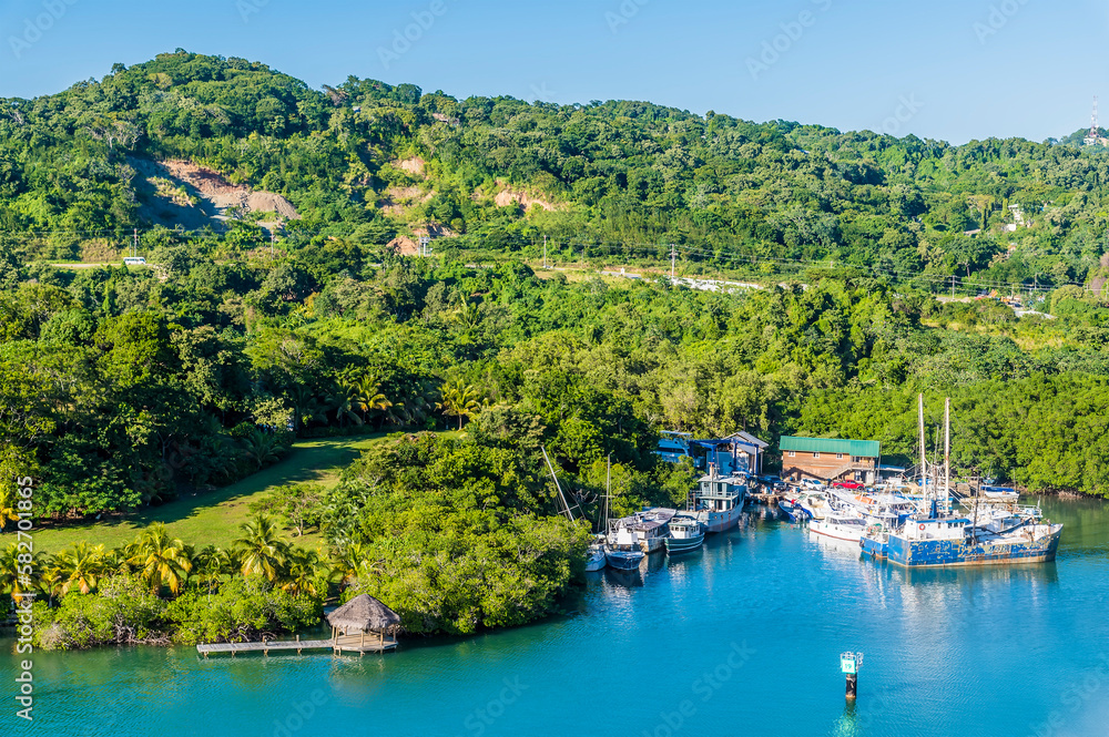 Wall mural A view from the cruise terminal of boats moored on Roatan Island on a sunny day