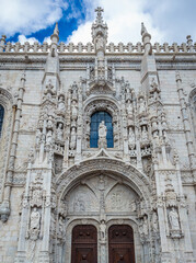 Fototapeta na wymiar One of the portals of Jeronimos Monastery in Belem area, Portugal