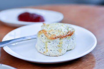 scone , sesame scone or scone with strawberry sauce