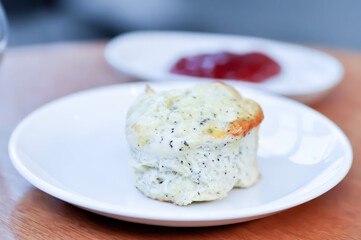 scone , sesame scone or scone with strawberry sauce
