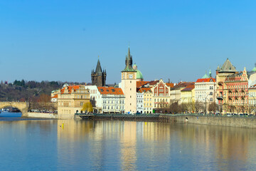 Fototapeta na wymiar View of the embankment of the Vltava River in Prague, historical buildings, Charles Bridge