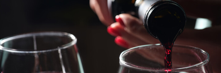 Woman pouring red wine into glass, tasting and degustation - obrazy, fototapety, plakaty