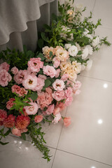 Main table at a wedding reception with beautiful fresh flowers and candles.