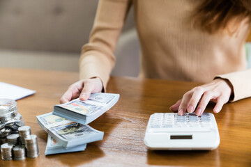 Woman with coin stack. Financial Growing savings concept. Saving money by hand putting coins money accounting planning.