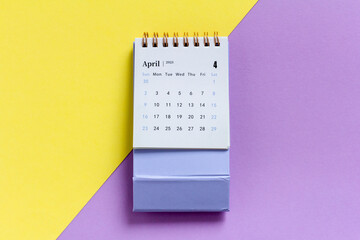 Desktop calendar for April 2023. Calendar for planning on a colored background.