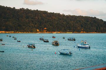 Fototapeta premium Terengganu, Malaysia - March 16, 2023 Colourful boats in Perhentian Island in the morning.