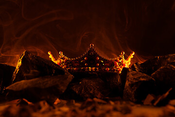 Golden crown on fire. Fantastic and fabulous composition on dark background. Panoramic view of the...