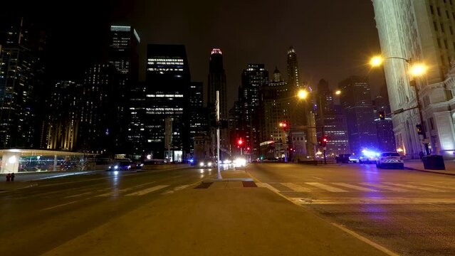 Chicago IL USA February 24th 2023:Night time lapse of Chicago streets downtown. the cars in traffic left trails of lights as they speed by on the expressway in this urban expressway 