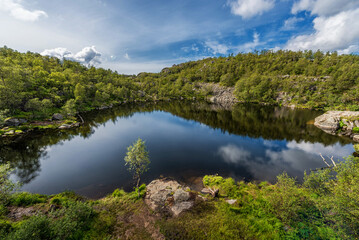 Fototapeta na wymiar Norway Landscape. Mountain, Blue Sky. Reflection on Mountains Lake.