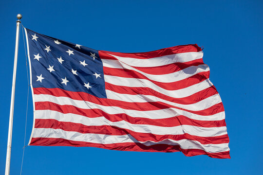 USA Flag Waving in Blue Background. American Wave Flag