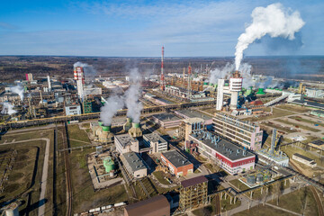 Chemistry Factory in Lithuania, Achema in Jonava City. Clear Blue Sky and Smoke in background. Drone