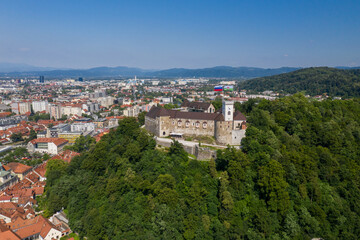 Fototapeta na wymiar Ljubljana Castle and old town in Slovenia. Ljubljana is the largest city. It's known for its university population and green spaces, including expansive Tivoli Park. The curving Ljubljanica River