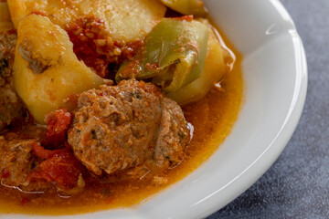 Meatballs with tomatoes, peppers and potatoes