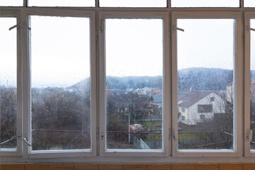 Old antient white windowwith mountains view.