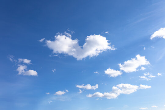 Heart shaped cloun in blue sky, love symbol concept.