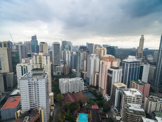 Fototapeta premium Manila Cityscape, Makati City with Business Buildings and Cloudy Sky. Philippines. Skyscrapers in Background.