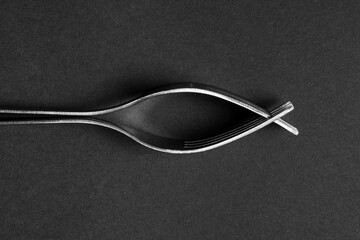 Pair of Kitchen Forks Locked Together