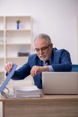 Old male employee and too much work at workplace