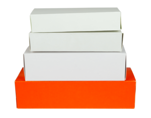 Pile of red and white cardboard boxes isolated from background