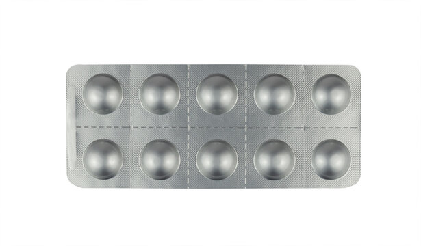 Tablets in a silver blister package isolated from background
