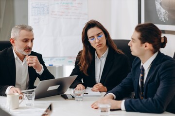 Businesspeople during office brainstorming. Company ceo and office workers at conference. Business partners in the meeting room