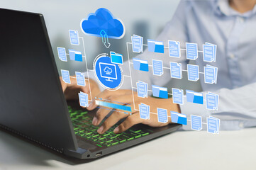 businessman  working on a laptop using FTP (File Transfer Protocol) with a paperless system.