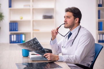 Young male doctor radiologist working in the clinic