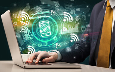 Business hand typing on a modern laptop