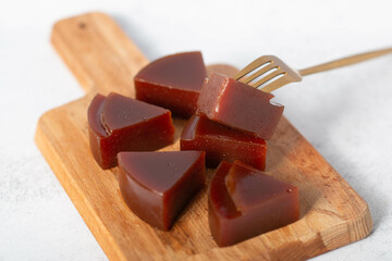 Typical Brazilian specialty: guava paste slices on white plate.