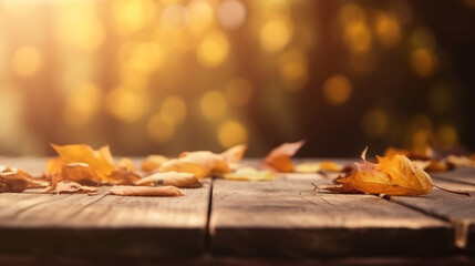Naklejka na ściany i meble Autumn - Wooden Table With Orange Leaves At Sunset In Defocused Abstract Background