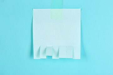 Blank paper tear-off ad on blue background